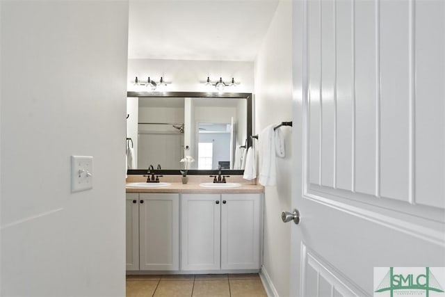 bathroom featuring tile patterned flooring and vanity