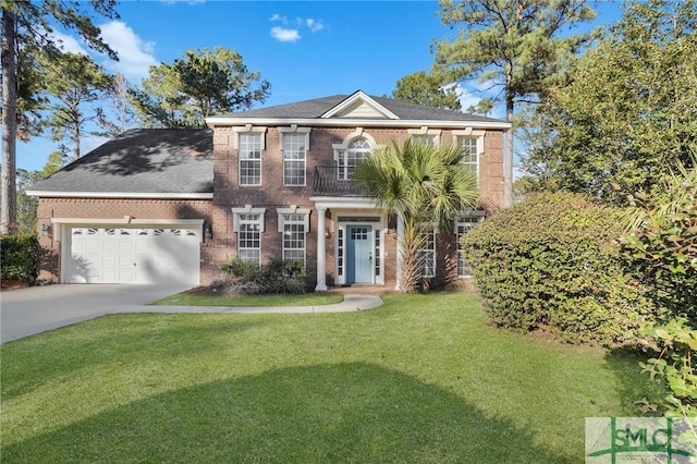 colonial-style house featuring a garage and a front lawn