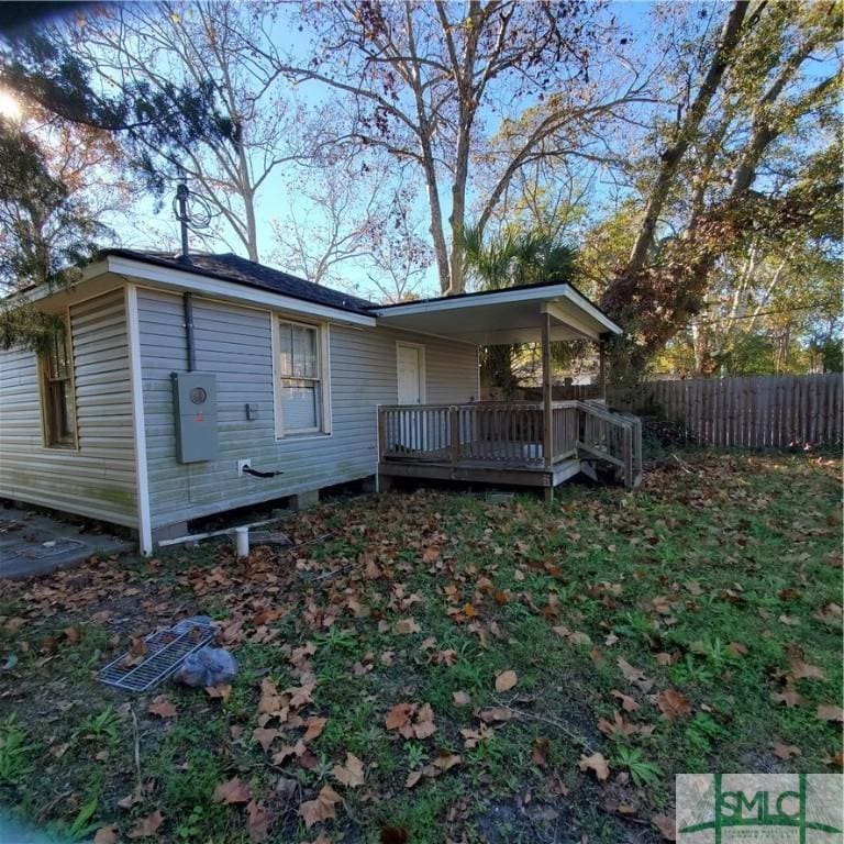 back of property featuring a deck