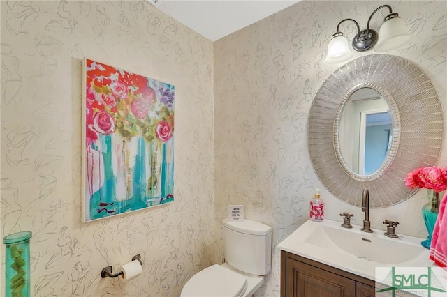 bathroom with vanity and toilet