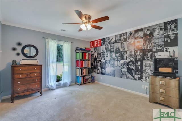 miscellaneous room featuring light carpet, ceiling fan, and ornamental molding