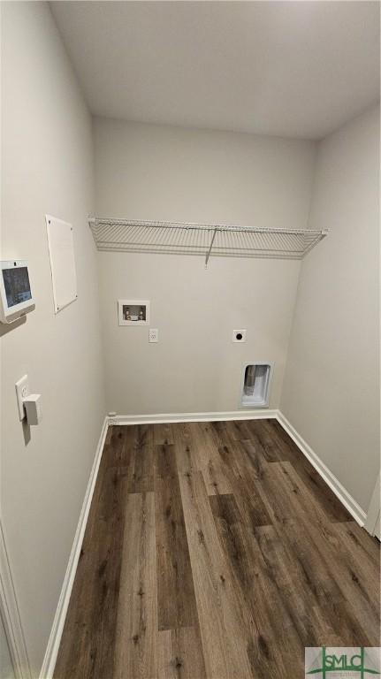 clothes washing area with hookup for an electric dryer, dark wood-type flooring, and hookup for a washing machine