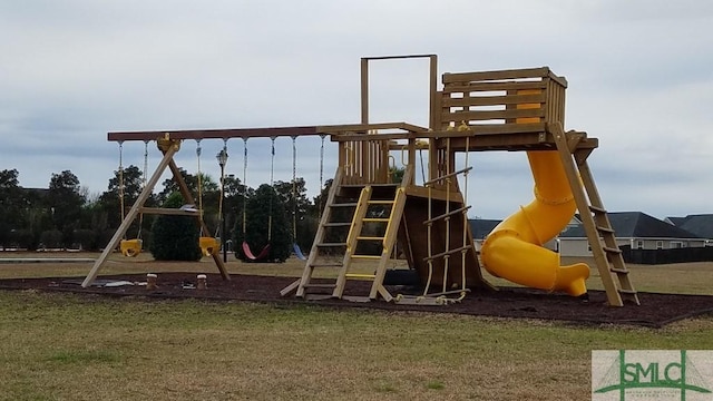 view of playground with a lawn