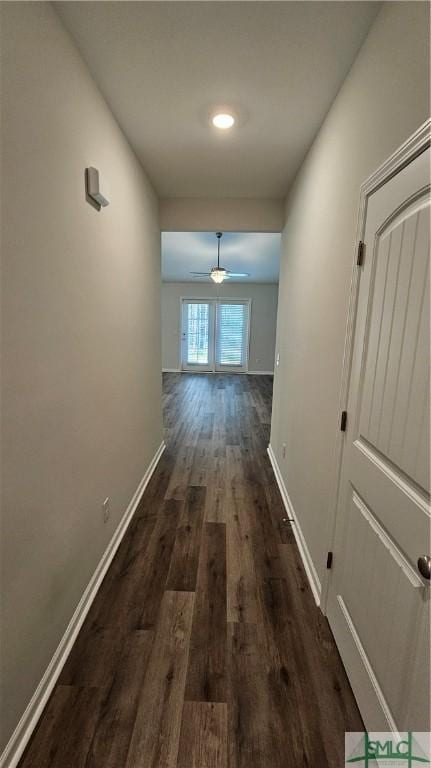 hall with dark hardwood / wood-style floors