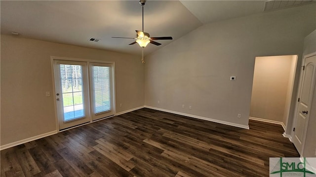 empty room featuring dark hardwood / wood-style flooring, ceiling fan, and lofted ceiling