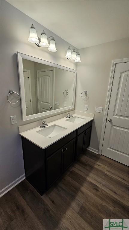 bathroom featuring vanity and hardwood / wood-style flooring