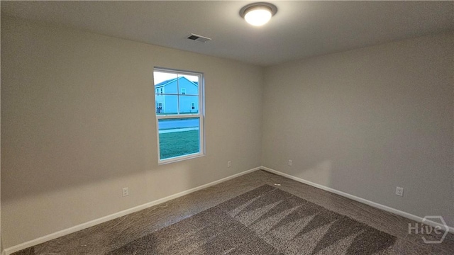 83 Marsh Salt Ln, Port Wentworth, GA 31407 - unfurnished room featuring dark colored carpet and baseboards