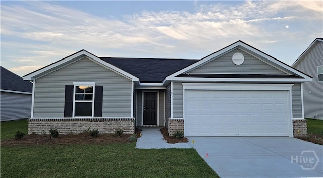 83 Marsh Salt Ln, Port Wentworth, GA 31407 - view of front of home with brick siding, driveway, a garage, a front lawn, and a shingled roof