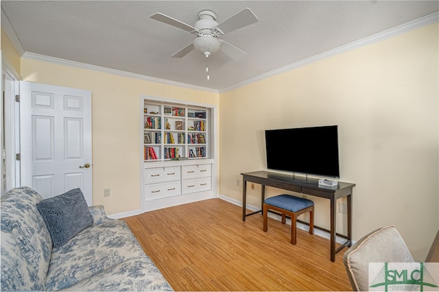 living room featuring a textured ceiling, light hardwood / wood-style flooring, ceiling fan, and crown molding