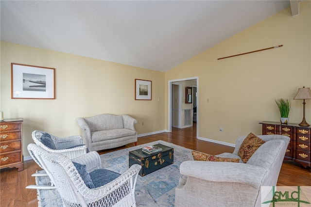 living room featuring hardwood / wood-style floors and vaulted ceiling