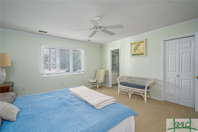 carpeted bedroom featuring a textured ceiling, ceiling fan, and crown molding