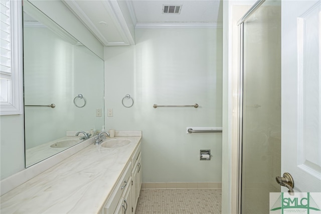 bathroom with tile patterned flooring, vanity, ornamental molding, and walk in shower