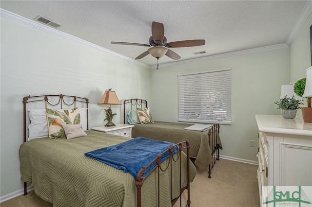 bedroom featuring light carpet, a textured ceiling, ceiling fan, and ornamental molding