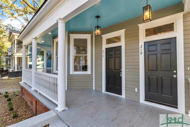 entrance to property featuring a porch