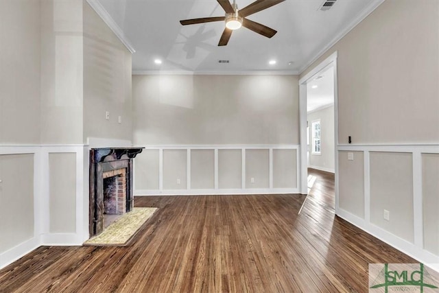 unfurnished living room with ceiling fan, hardwood / wood-style flooring, and ornamental molding