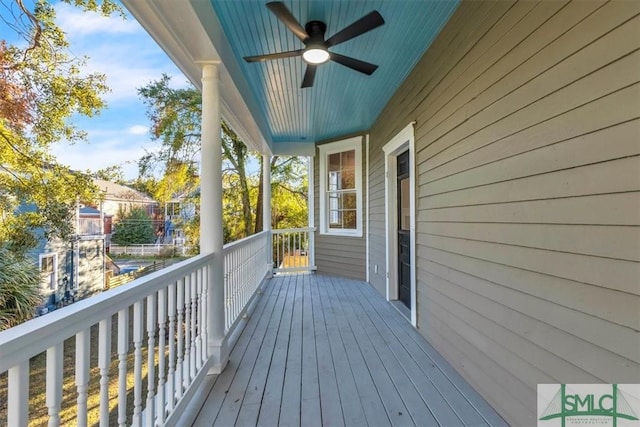 wooden deck with ceiling fan