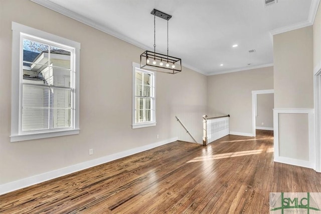 unfurnished dining area featuring hardwood / wood-style flooring and ornamental molding