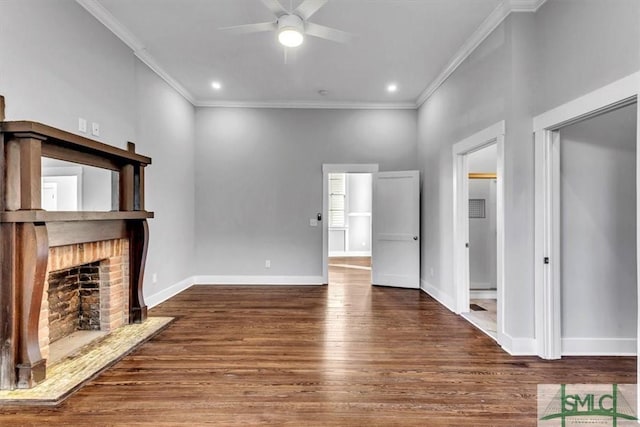 unfurnished living room with dark hardwood / wood-style flooring, a brick fireplace, and ornamental molding