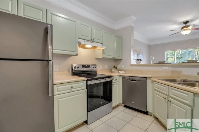 kitchen with sink, ceiling fan, light tile patterned floors, ornamental molding, and appliances with stainless steel finishes