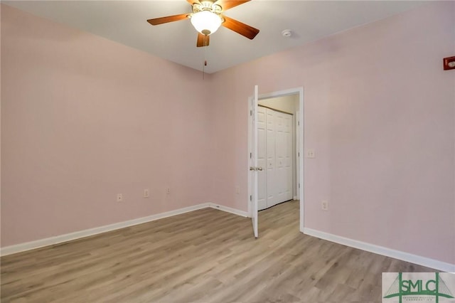 unfurnished room featuring light wood-type flooring and ceiling fan