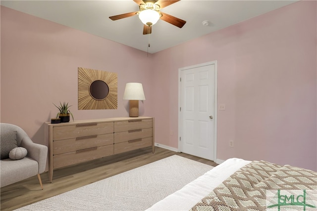 bedroom featuring ceiling fan and light hardwood / wood-style flooring