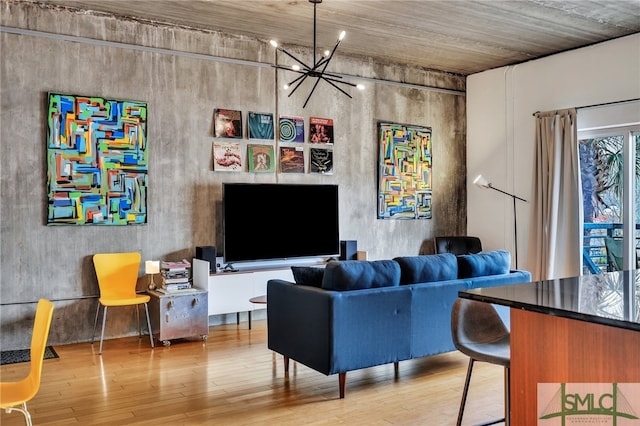 living room featuring a chandelier and hardwood / wood-style floors