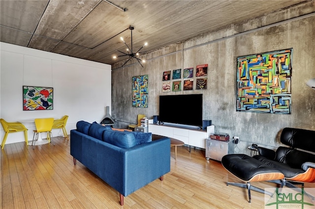 living room featuring a chandelier and hardwood / wood-style floors