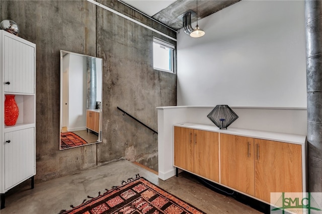 bathroom featuring concrete flooring