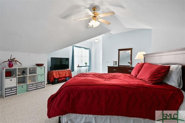 carpeted bedroom with lofted ceiling and ceiling fan