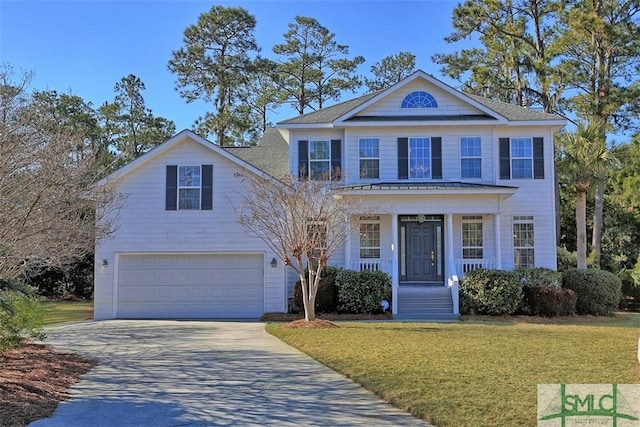 view of front of house with a front yard and a garage