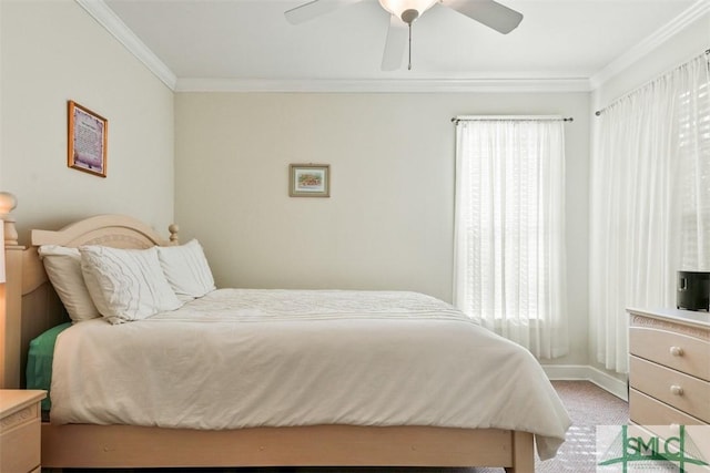 carpeted bedroom featuring crown molding and ceiling fan