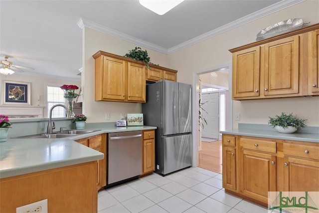 kitchen with appliances with stainless steel finishes, light tile patterned floors, ceiling fan, ornamental molding, and sink