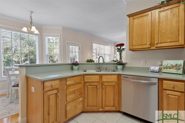 kitchen with crown molding, sink, stainless steel dishwasher, and kitchen peninsula