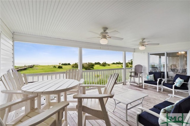 sunroom / solarium with ceiling fan