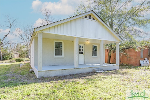 view of front of property with a front lawn and a porch