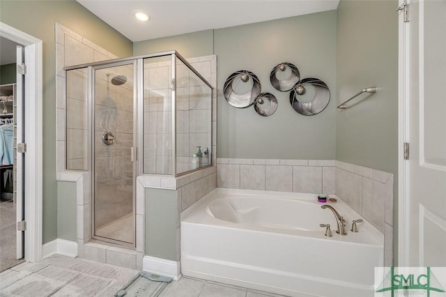 bathroom featuring tile patterned floors and plus walk in shower