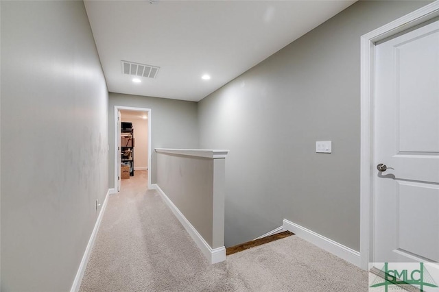 hallway with light carpet