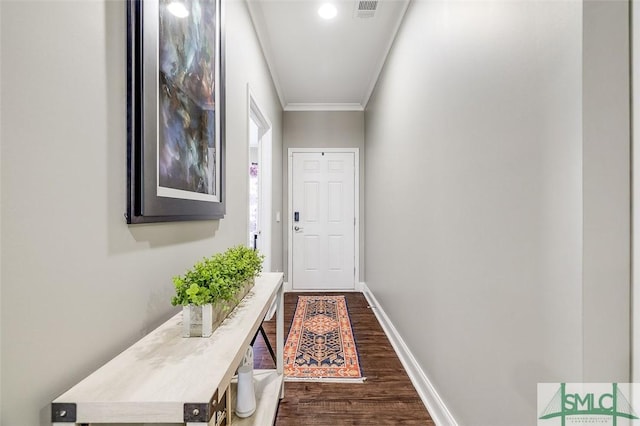 hallway with dark hardwood / wood-style flooring and ornamental molding