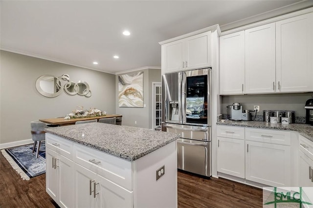 kitchen featuring light stone countertops, dark hardwood / wood-style flooring, crown molding, stainless steel fridge with ice dispenser, and white cabinetry