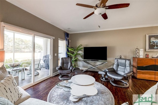 living room with ceiling fan, dark hardwood / wood-style flooring, and ornamental molding