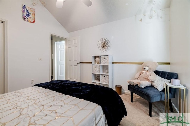 bedroom featuring ceiling fan, lofted ceiling, and light carpet