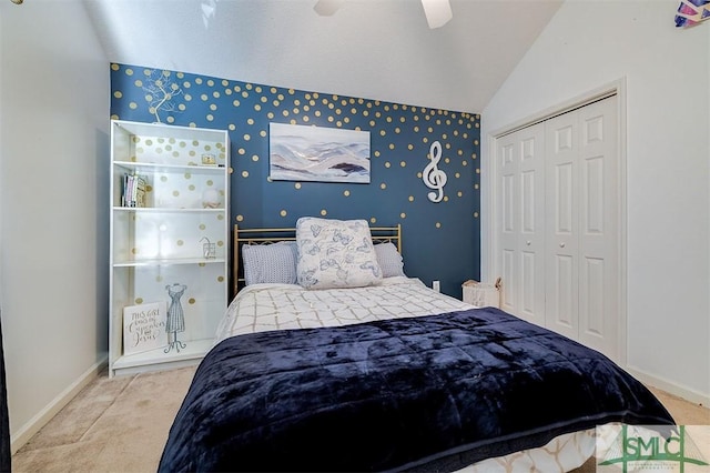 bedroom with a closet, vaulted ceiling, and ceiling fan