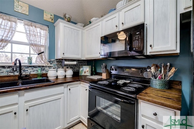 kitchen featuring backsplash, a textured ceiling, sink, black appliances, and white cabinetry