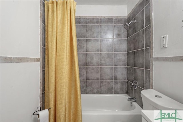 full bathroom featuring shower / bath combo, vanity, and toilet