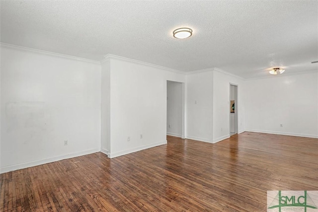 unfurnished room with crown molding, dark hardwood / wood-style flooring, and a textured ceiling