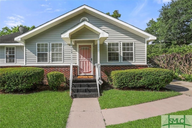 bungalow with a front lawn