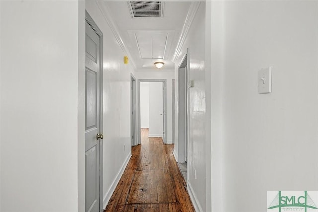 hall with hardwood / wood-style flooring and ornamental molding