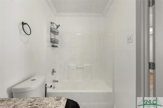 bathroom featuring crown molding, toilet, and tub / shower combination