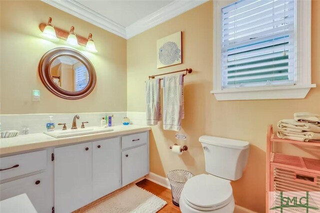 524 E Duffy St, Savannah, GA 31401 - half bath with vanity, ornamental molding, and wood finished floors