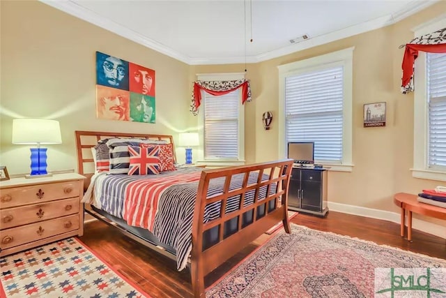 bedroom with wood-type flooring and ornamental molding